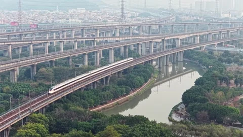 High speed passenger train passing over bridges, modern city railway system. Stock Footage 330529657