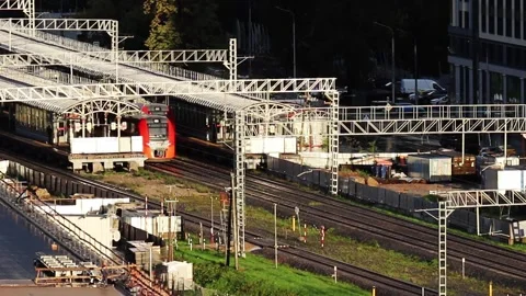 High-speed passenger trains arrive at a railway station in a major city Vídeos de archivo 161351666
