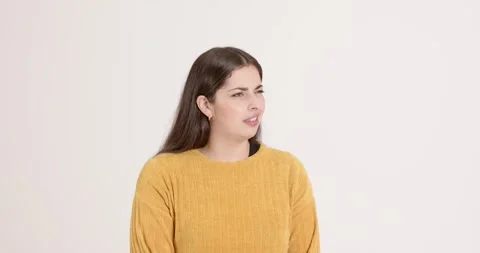 High-speed photography for dynamic scenes, woman in yellow sweater making Stock Footage 345568685
