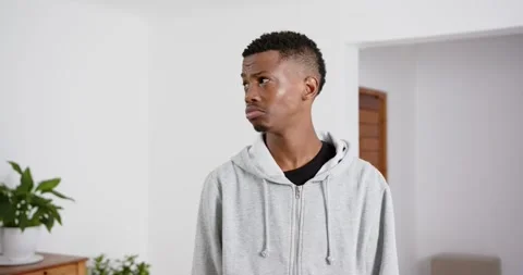 High speed photography for dynamic scenes, Looking concerned, man in gray hoodie Stock Footage 345713890