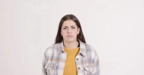 High-speed photography for dynamic scenes, looking confused, woman in plaid Stock Footage 346026367