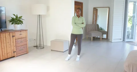 High-speed photography for dynamic scenes, woman standing in living room, Stock Footage 346026578