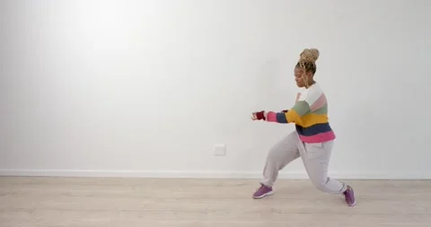 High speed photography for dynamic scenes, Dancing in colorful sweater, woman Stock Footage 346135335
