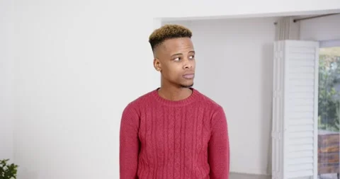 High speed photography for dynamic scenes, man in red sweater standing indoors, Stock Footage 346218525