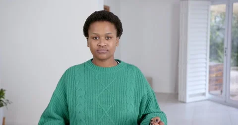 High speed photography for dynamic scenes, woman in green sweater looking Stock Footage 346218648