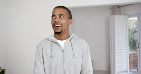 High speed photography for dynamic scenes, man in grey hoodie standing indoors, Stock Footage 346295394