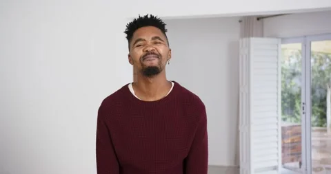 High speed photography for dynamic scenes, man in maroon sweater making funny Stock Footage 346523235