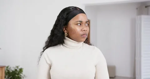 High speed photography for dynamic scenes, woman in turtleneck looking to side Stock Footage 346523310