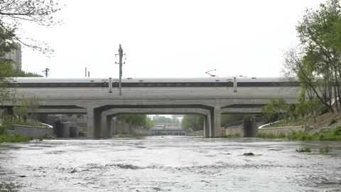 High-speed rail passing the bridge Stock Footage 244997859