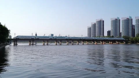 High speed railway train in motion China Railway Harmony Railway Elevated Touris Stock Footage 243038665