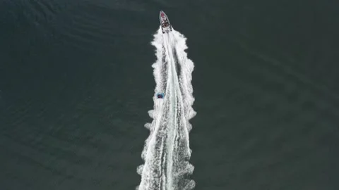 High speed rib and doughnut ride aerial Stock Footage 143037616