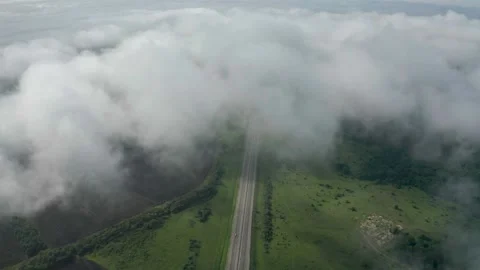 High-speed road among the fields on which cars are moving aerial view. Stock Footage 169957011