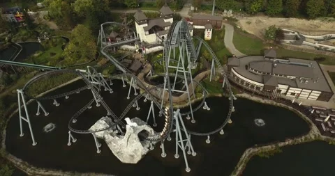 A high-speed rollercoaster in an amusement park in Poland during the Vídeo Stock 245286885