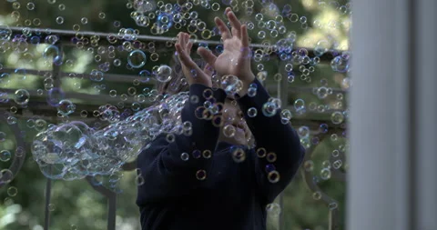High-Speed Slow-Motion of Boy Surrounded by Countless Soap Bubbles, Little .. Stock Footage 254819485