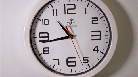 High-Speed Time-Lapse of a Minimalist White Clock on a White Wall 動画素材 337788595