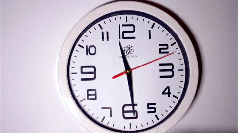 High-Speed Time-Lapse of a White Wall Clock with a Red Second Hand Stock Footage 337081944