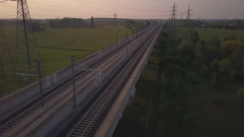 High speed train during sunset at high perspective Stock Footage
