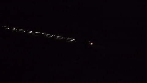 High Speed train entering city By Night Stock-Footage 249335772