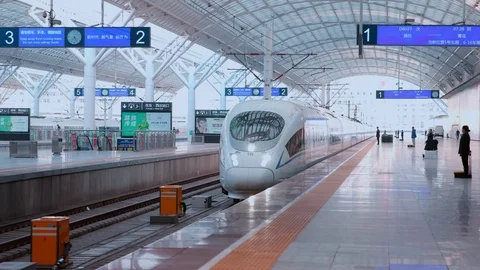 A High-speed train enters the train station platform. 4K Stock Footage 108855219