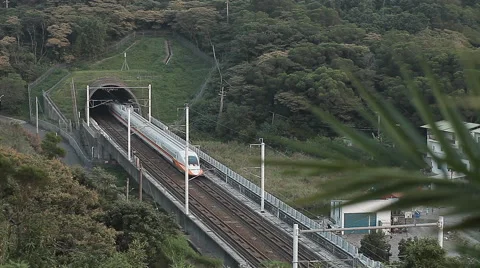 High speed train leaves tunnel Stock Footage 42109642