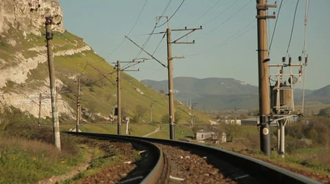 High speed train. Mountain landscape. Shoot from railroad tracks. Stock Footage 37811731