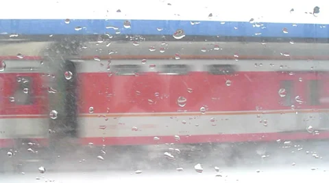 High speed train is moving rapidly through a snow storm in a railway station Stock Footage 34883008