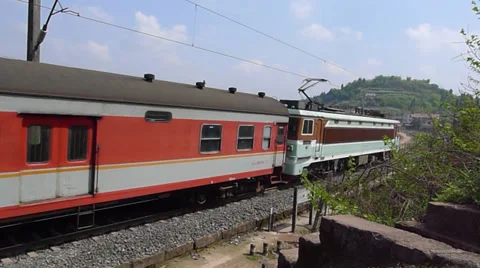 High speed train is moving rapidly along a river, with sound Stock Footage 37058672