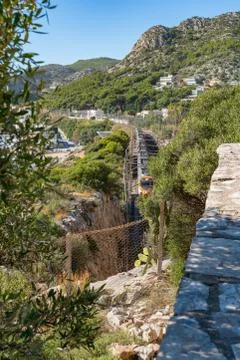 High-speed train is moving through the mountains. Stock Photos