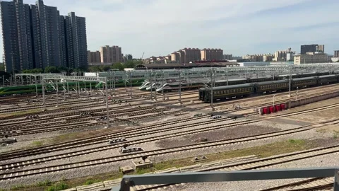 High speed train parked at a large urban railway station Stock Footage 338092080