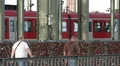 High Speed Train Passing Commuters Commuting People Walk Cologne Famous Bridge HD Footage