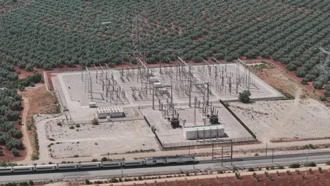 High speed train passing an electrical substation in Archidona, Spain Stock Footage 340348649