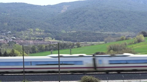 High speed train passing near forests Stock Footage 238034374