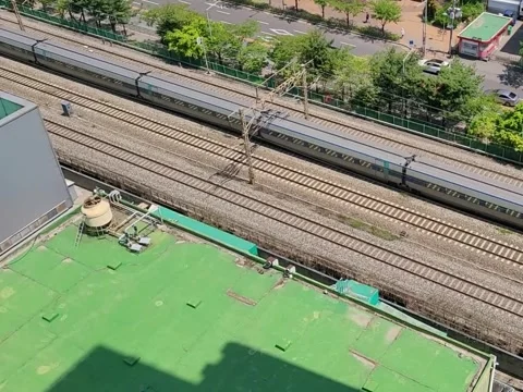 High-Speed Train Passing Through Seoul City Railway from Above Video stock 320095964