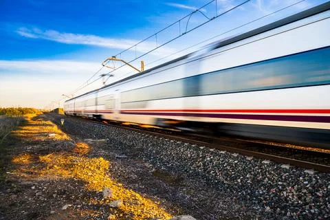 High Speed Train Passing Through Countryside in Sevilla Stock Photos