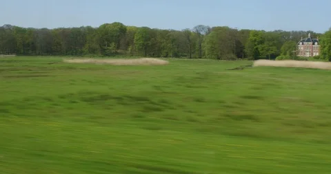 High speed train passing tulip field Stock Footage 88975585