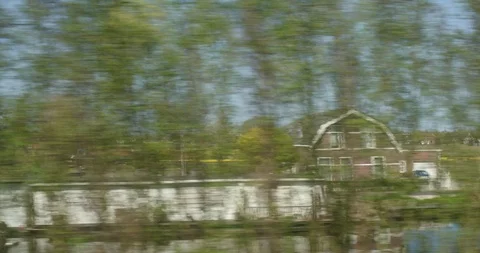 High speed train passing tulip field Stock Footage 88979313