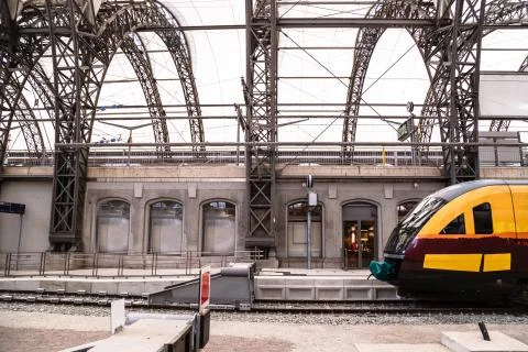 High-speed train on platform of railway station Stock Photos