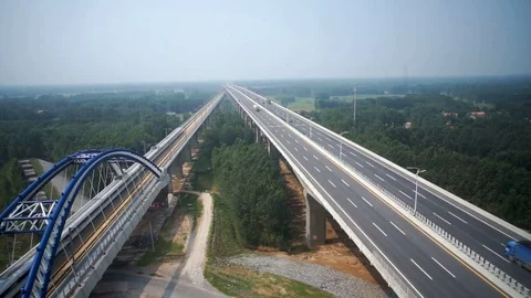 High speed train running more faster than cars Stock Footage 72177186