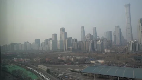 A high-speed train running past Beijing's central business area Stock Footage 234313738