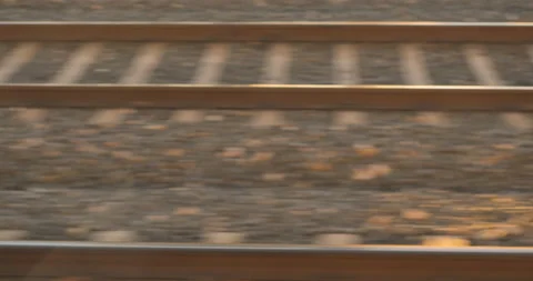 High speed train tracks passing from the window in evening light Stock Footage 216549938