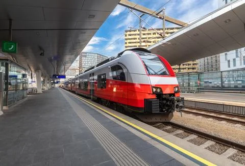 High speed train on the train station at sunset in Vienna, Austria. Beautif.. Stock Photos