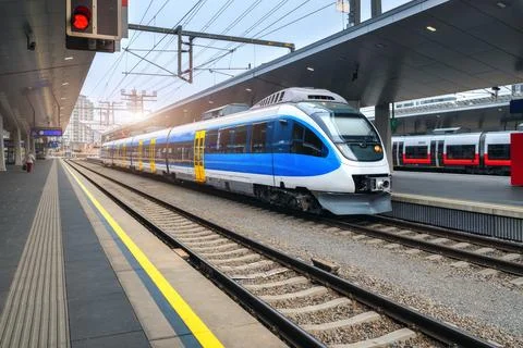 High speed train on the train station at sunset in Vienna, Austria. Beautif.. Stock Photos