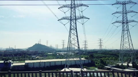 High Speed Train Window View Passing Through Rural Town and Industrial Landscape Vídeos de archivo 342101860