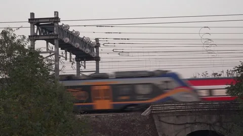High-Speed Trenitalia Frecciarossa Train Passing Through Railway Bridge at D Stock Footage 292635341