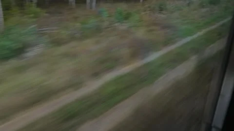High-speed view of ground and tracks from A train window. Abstract motion blur Stock-Footage 318907266