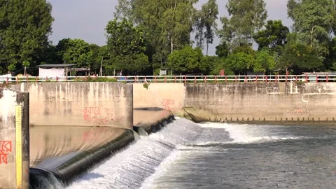 High-speed water overflow cascading down a rubber dam watering structure. Video stock 320070480