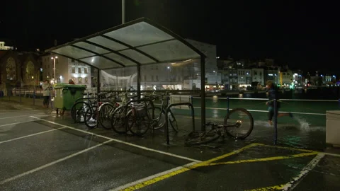 High spring tide causes flooding to town seafront at St Peter Port, Guernsey Stock Footage 254410106