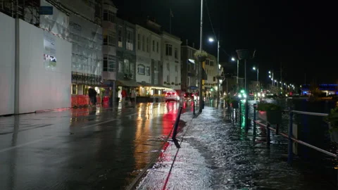 High spring tide causes flooding to town seafront at St Peter Port, Guernsey Stock Footage 254410140