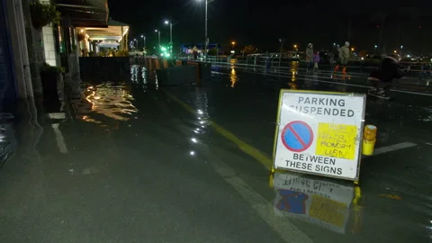 High spring tide causes flooding to town seafront at St Peter Port, Guernsey Stock Footage 254410219