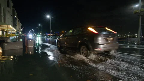 High spring tide causes flooding to town seafront at St Peter Port, Guernsey Stock Footage 254410276
